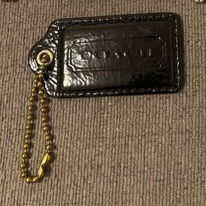 Coach black tag